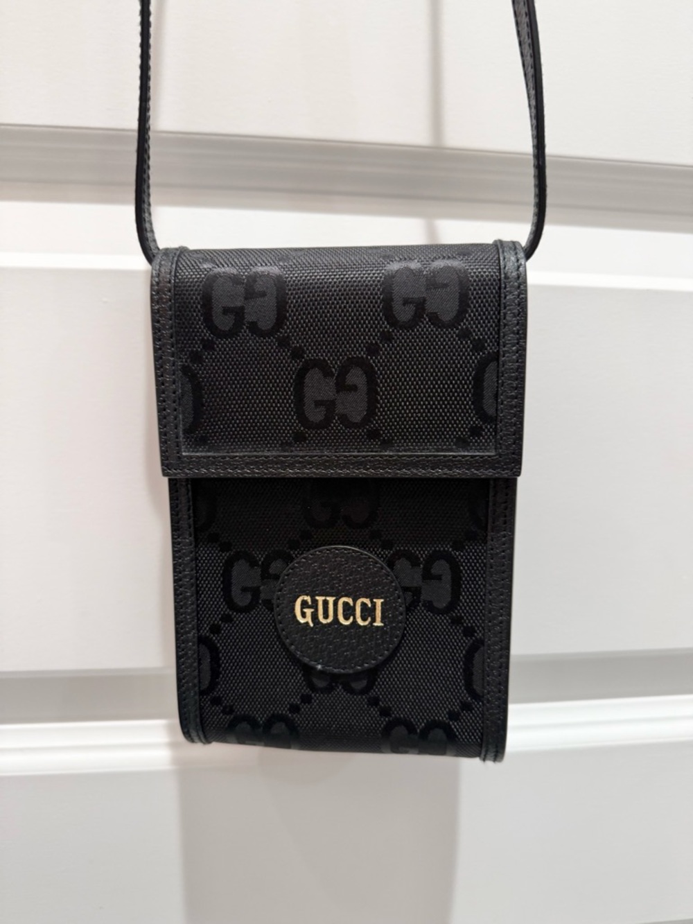 Gucci Black GG Supreme Crossbody Pouch with Gold Logo